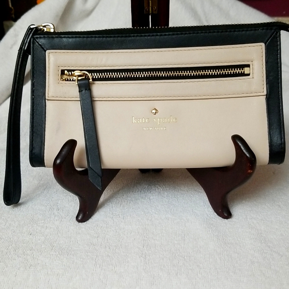 kate spade ♠️.  Large wallet, doubles as a wristlet.